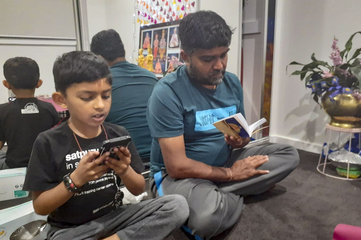Devotees read 'Satsang Diksha'