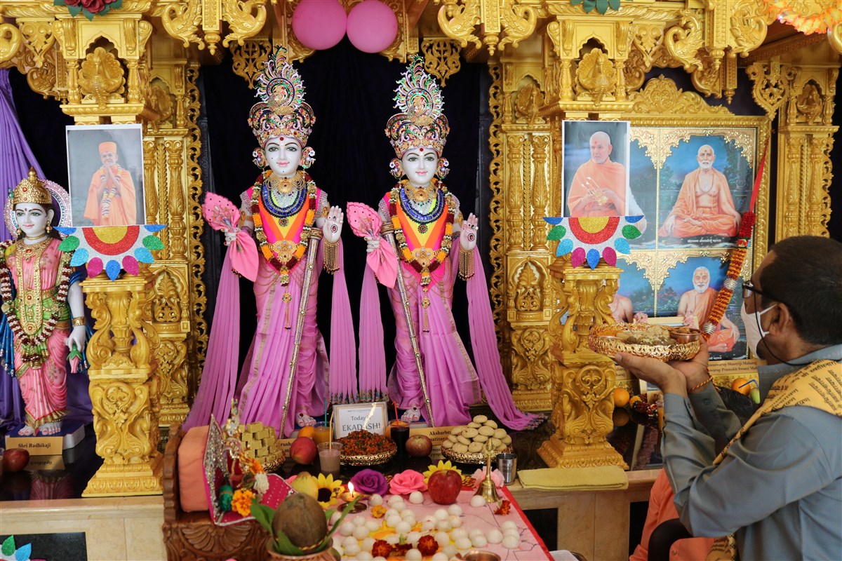 The resident pujari offers thal to the murtis at Lisbon Mandir as part of the patotsav ceremony
