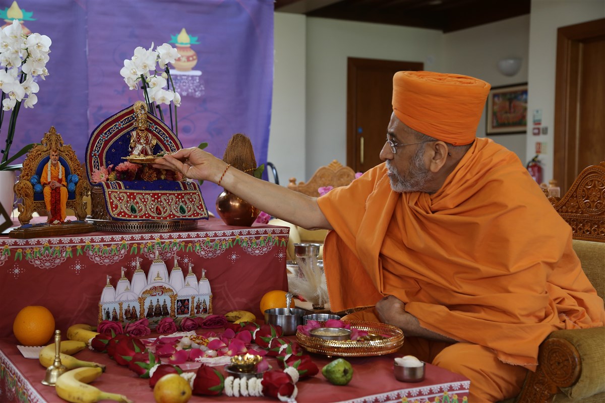 Aksharviharidas Swami offers thal to the murtis at London Mandir as part of the patotsav ceremony