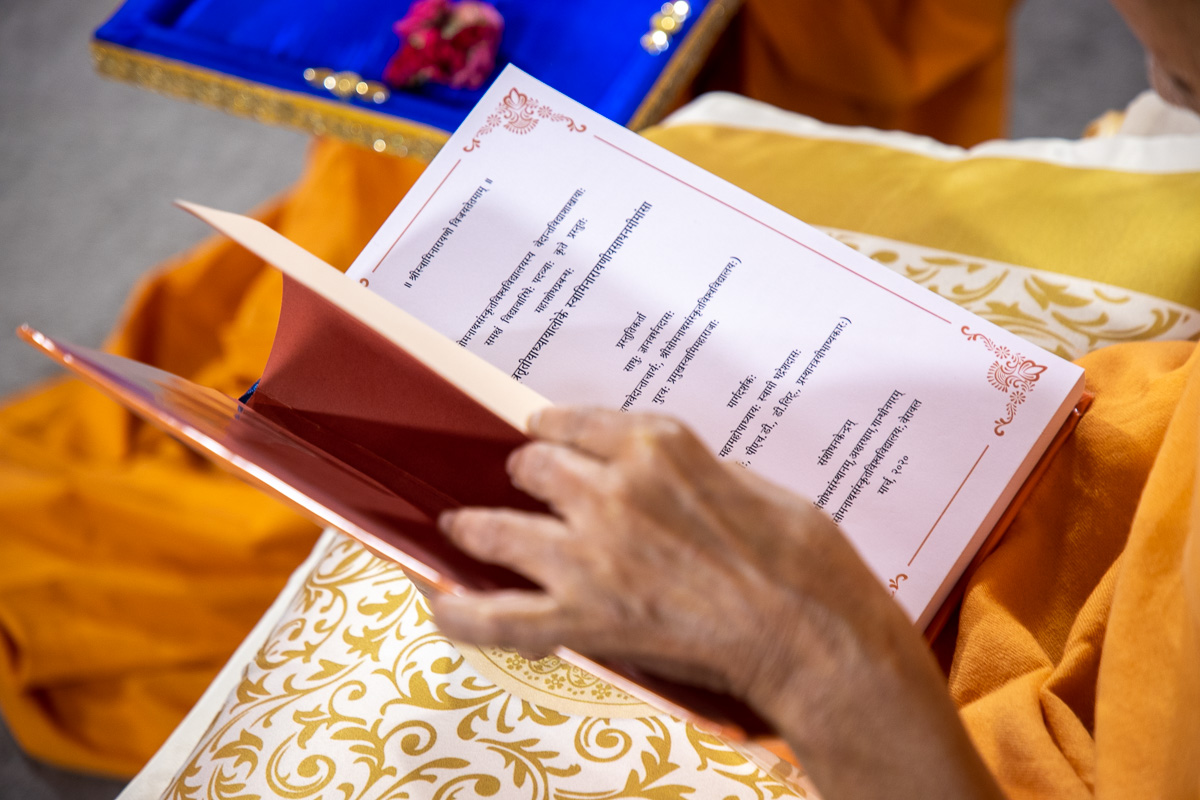 Swamishri blesses the PhD thesis written by Gnanvardhan Swami