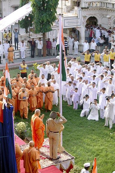  After the flag-hoisting ceremony devotees salute while singing the national anthem 