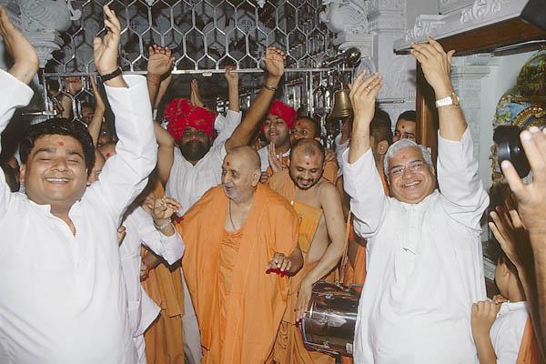  Devotees dance with joy before Swamishri in the mandir