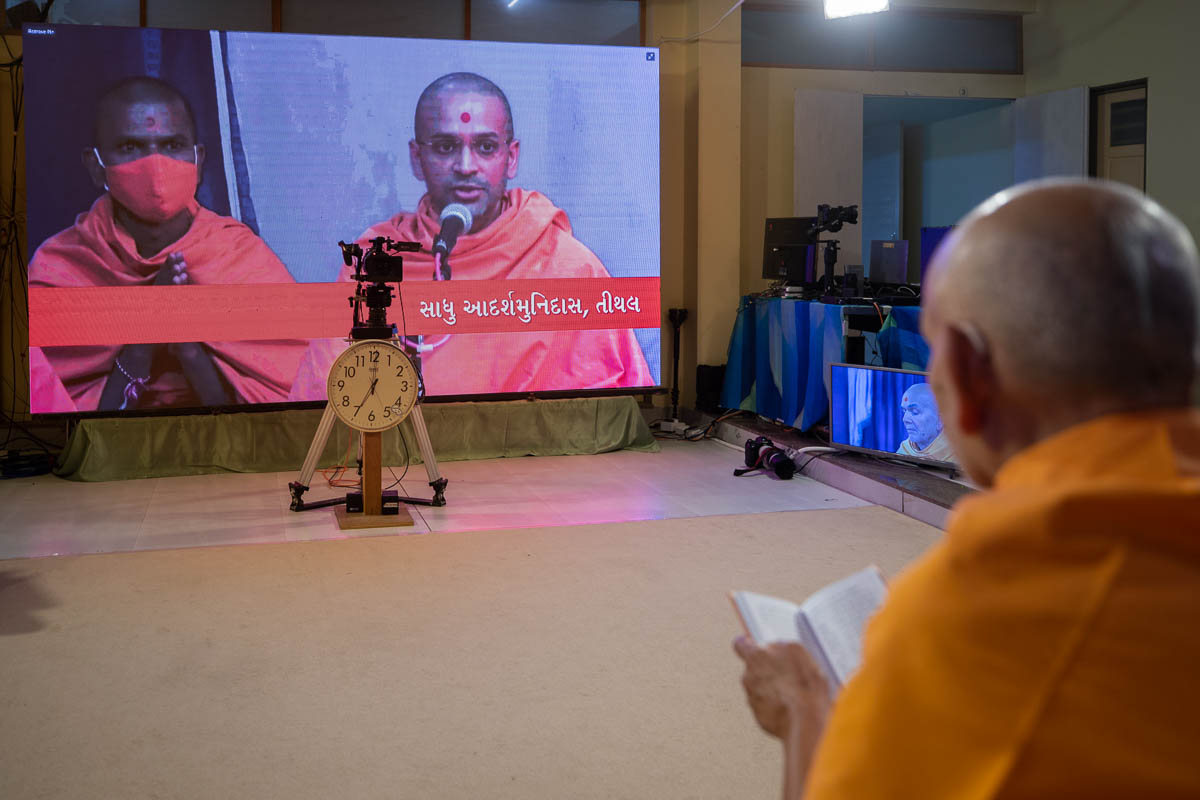 Adarshmuni Swami leads the recital of the daily prayers via video conference from Tithal Mandir