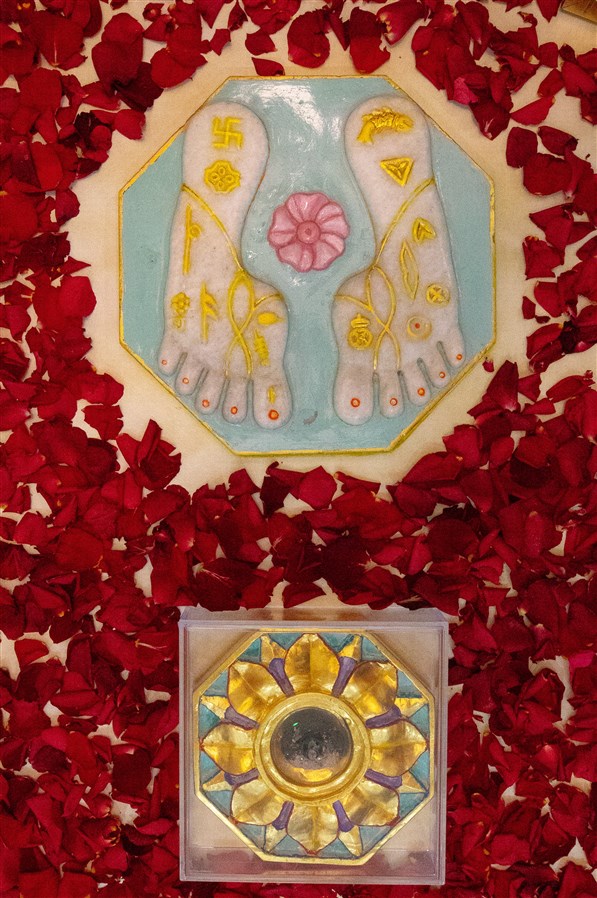 The marble charnarvind (sacred footprints) of Bhagwan Swaminarayan and asthi (holy ashes) of Pramukh Swami Maharaj