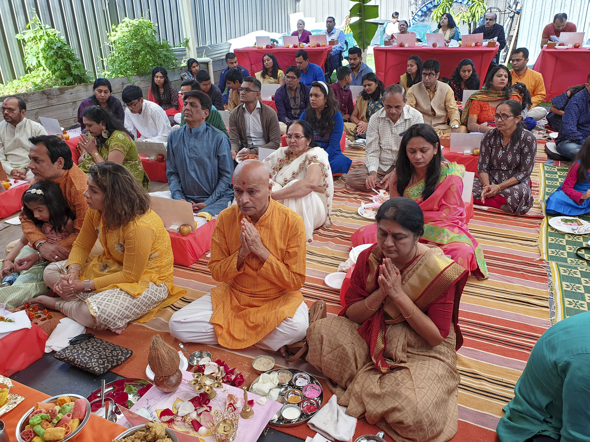A group of devotees participate in the Groundbreaking Ceremony rituals