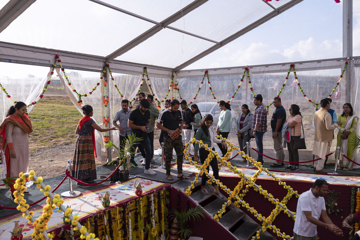 Devotees Place Their Worshiped Bricks