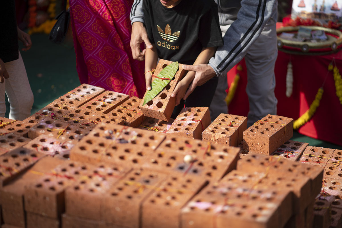 Devotees Place Their Worshiped Bricks