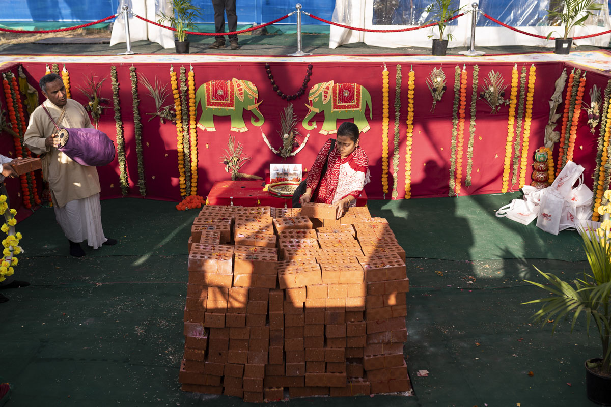 Devotees Place Their Worshiped Bricks