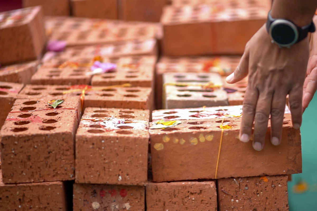 Devotees Place Their Worshiped Bricks