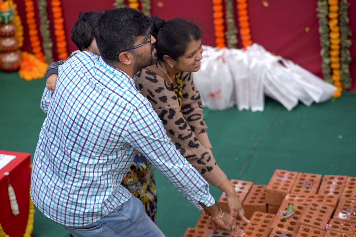 Devotees Place Their Worshiped Bricks