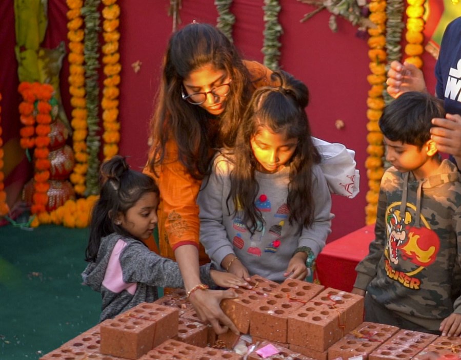 Devotees Place Their Worshiped Bricks