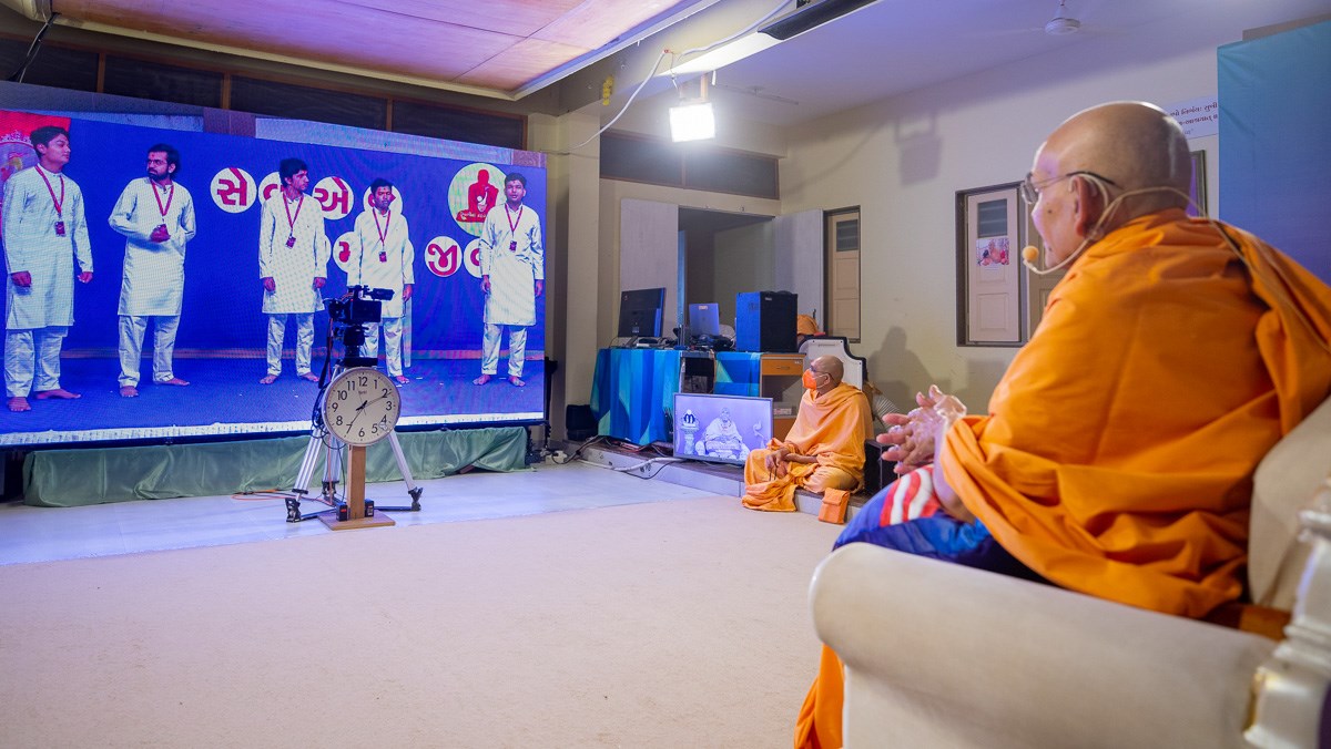 YTK youths present a skit before Swamishri via video conference from Sarangpur