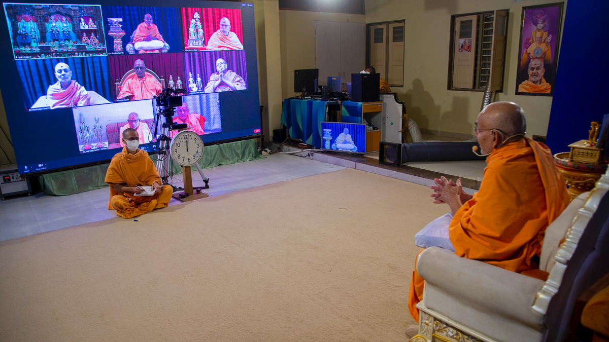 Senior sadhus, sadhus and devotees participate in the assembly via video conference