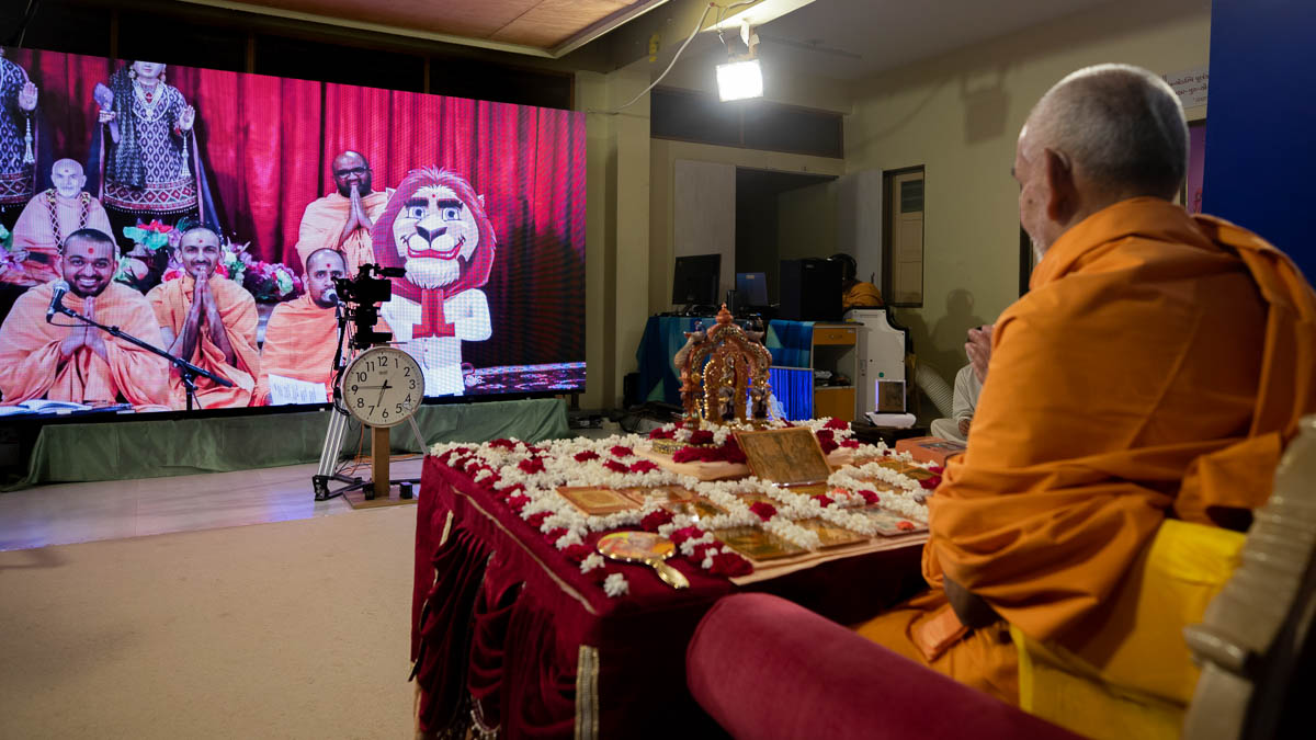 Sadhus doing darshan of Swamishri via video conference from Toronto Mandir