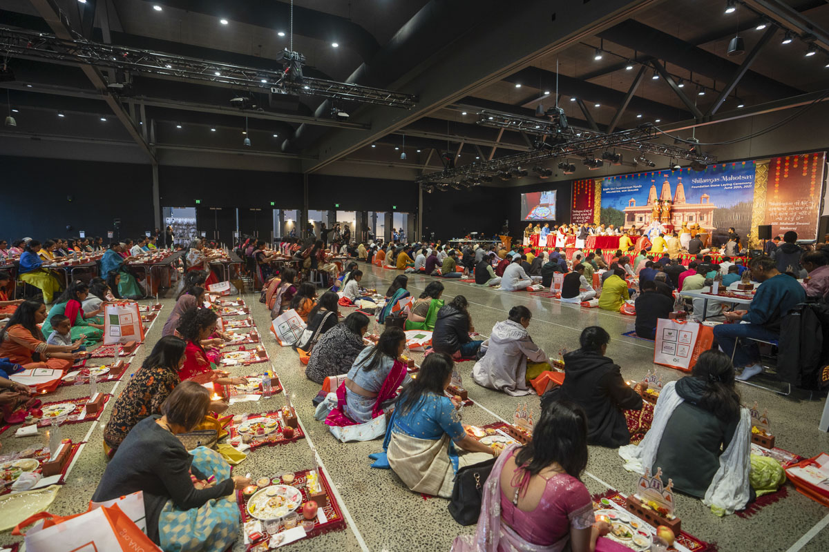 Devotees and well-wishers participate in the mahapuja rituals