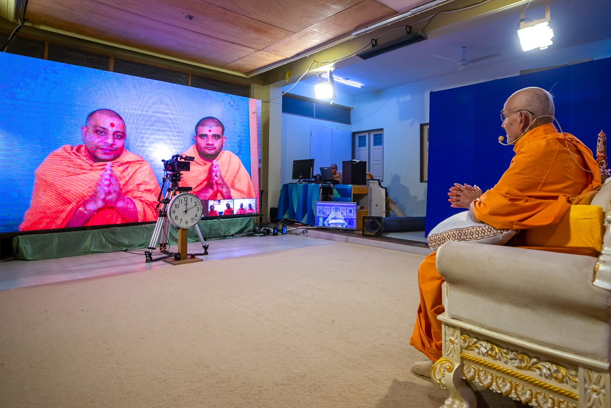 Sadhus from New Zealand doing darshan of Swamishri via video conference