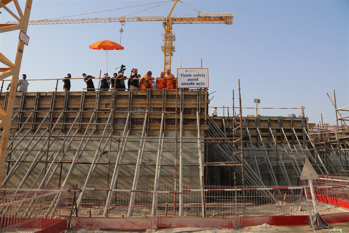 Pujya Ishwarcharan Swami observes the mandir site
