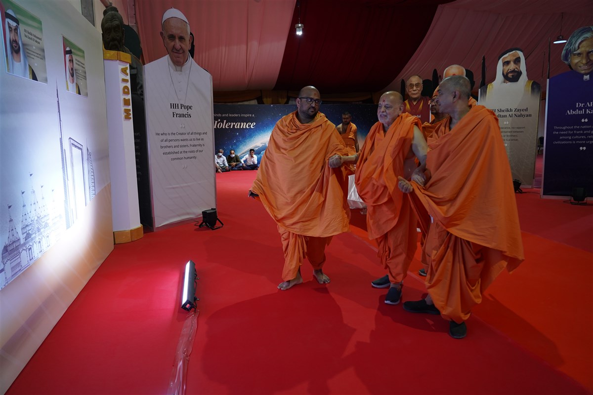 Pujya Ishwarcharan Swami views the on-site exhibition