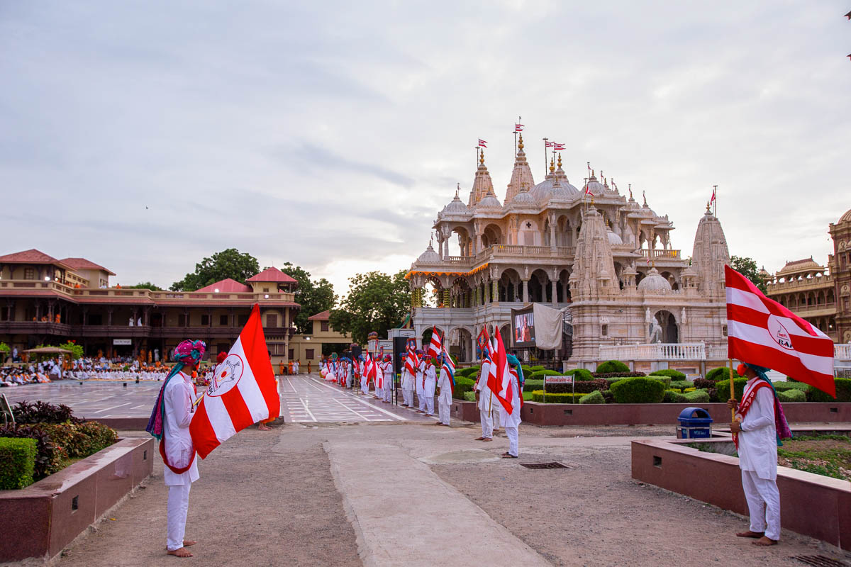Youths with BAPS flags in the mandir grounds