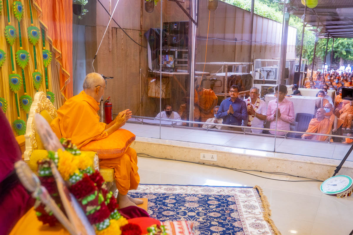 Swamishri blesses author of the new book Shri Kiritbhai Shelat (center) and his family