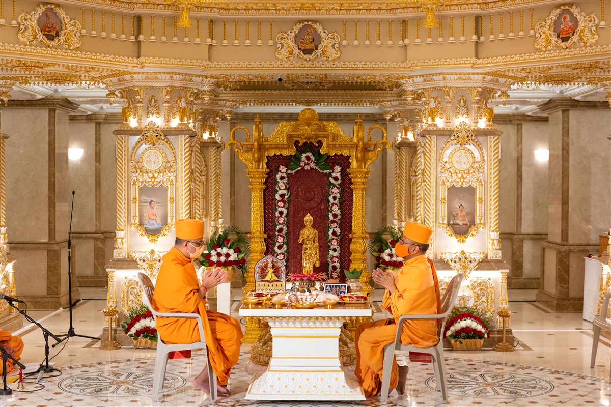Pujya Swamis engaged in the mandap opening rituals
