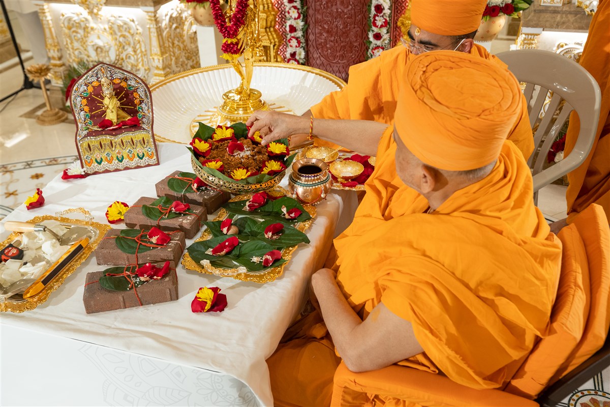 Pujya Ishwarcharan Swami engaged in the groundbreaking rituals for the new Charlotte Mandir
