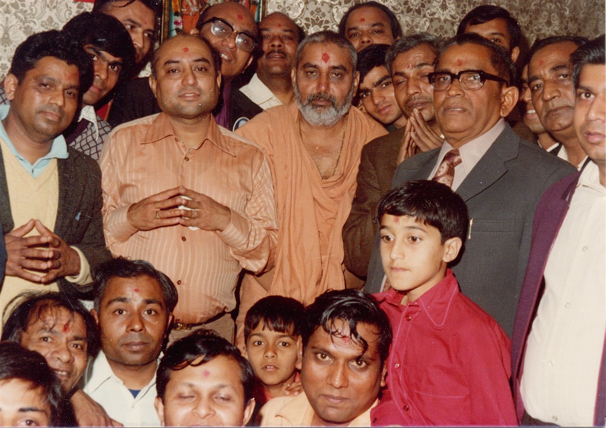 Pramukh Swami Maharaj with devotees of Manchester Satsang Mandal during his visit in 1974
