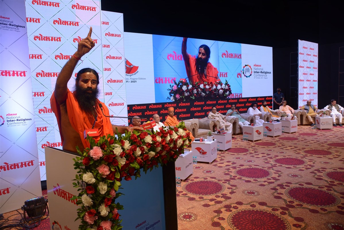 Swami Ramdev addressing the conference