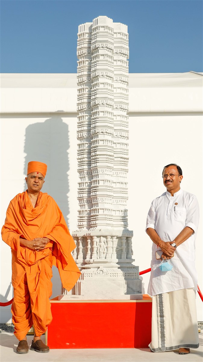 Brahmavihari Swami and Shri Murleedharan with a pillar of the mandir
