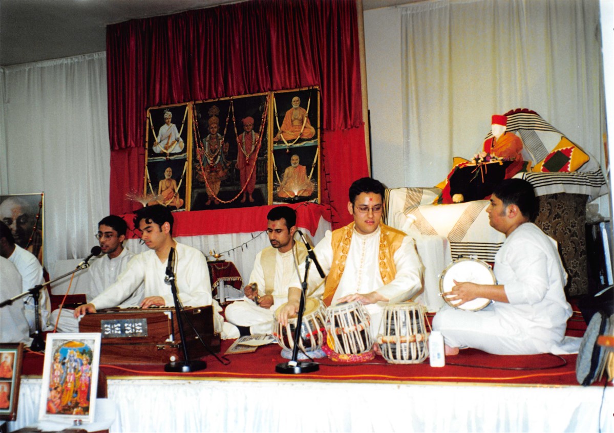 Youths perform kirtan bhakti during the Swaminarayan Jayanti and Rama Navmi celebrations in 2000