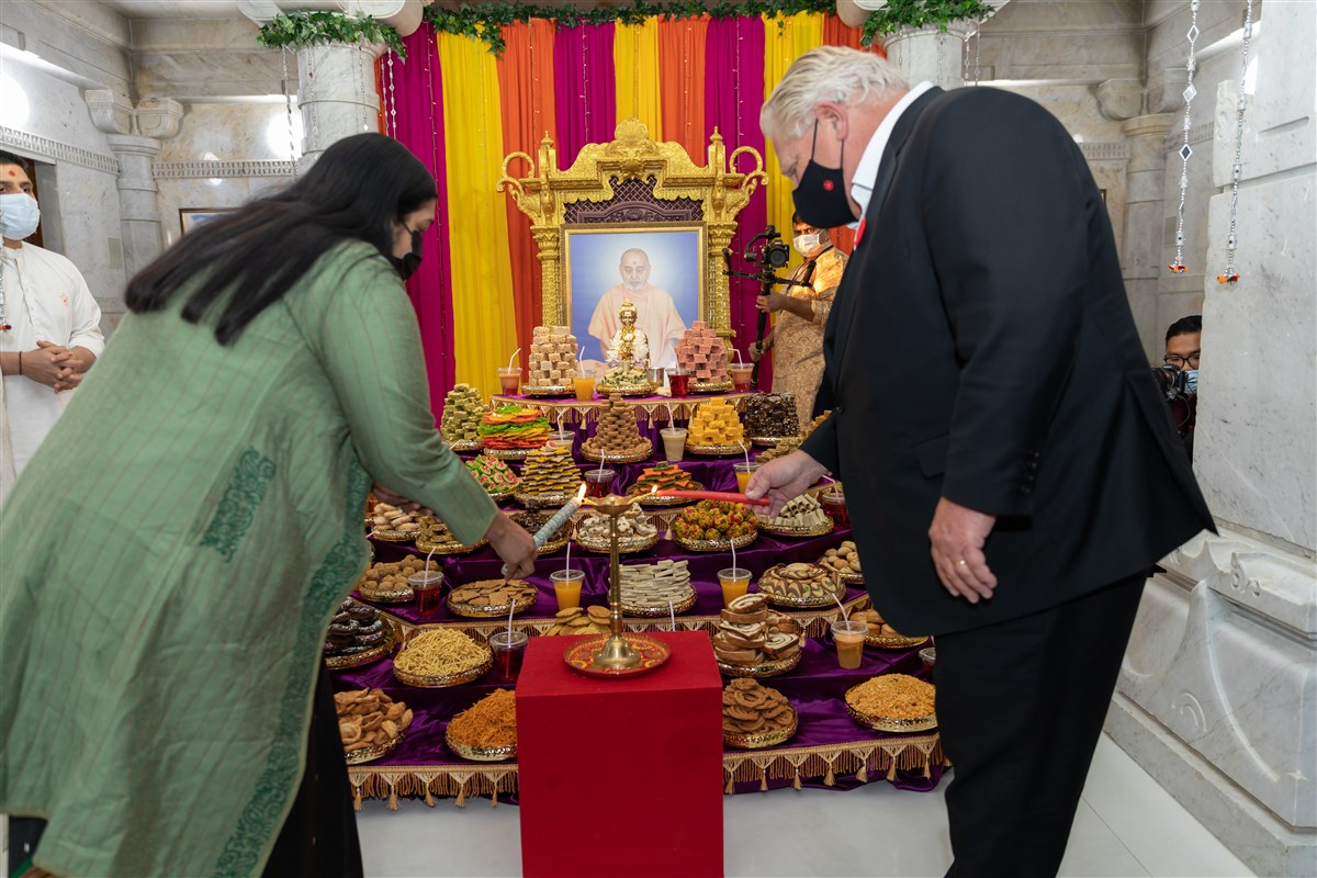Hon. Doug Ford, Premier of Ontario and Smt. Apoorva Srivastava, Consulate General of India, lighting the Diya