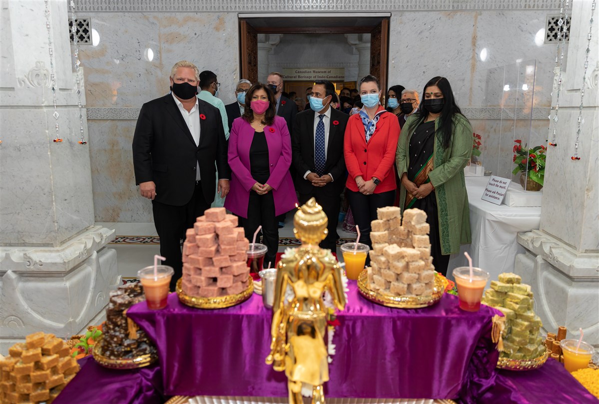 Hon. Doug Ford, Premier of Ontario, Hon. Nina Tangri, Associate Minister of Small Business and Red Tape Reduction, Deepak Anand MPP, Natalia Kesendova MPP, Smt. Apoorva Srivastava, Consulate General of India doing darshan of the Annakut