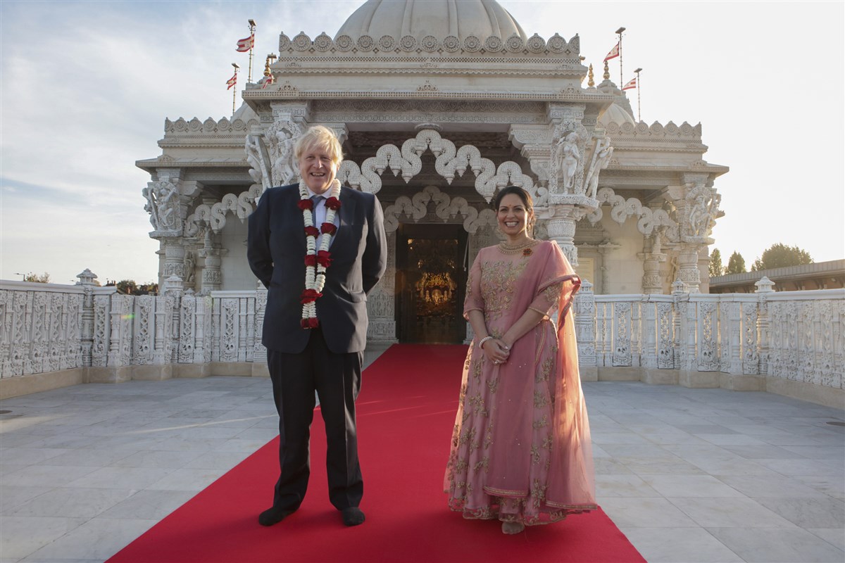 British Prime Minister Boris Johnson and Home Secretary Priti Patel joined the celebrations at the Mandir on Sunday. Click <a href='https://www.baps.org/News/2021/Prime-Minister-and-Home-Secretary-of-United-Kingdom-Visit-Neasden-Temple-for-Diwali-20342.aspx' target='blank' style='text-decoration:underline; color:blue;'>here</a> for a full report
