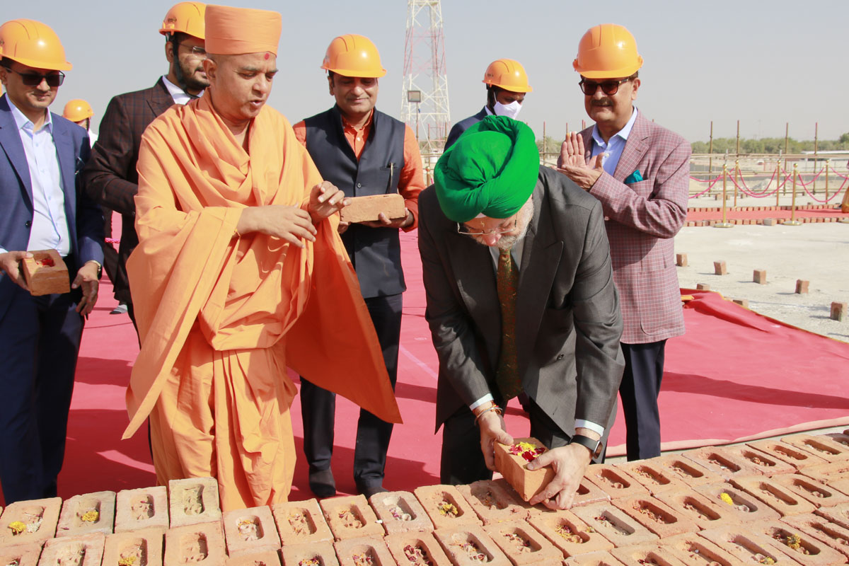 Honorable Minister places a sanctified brick upon the plinth of the upcoming mandir