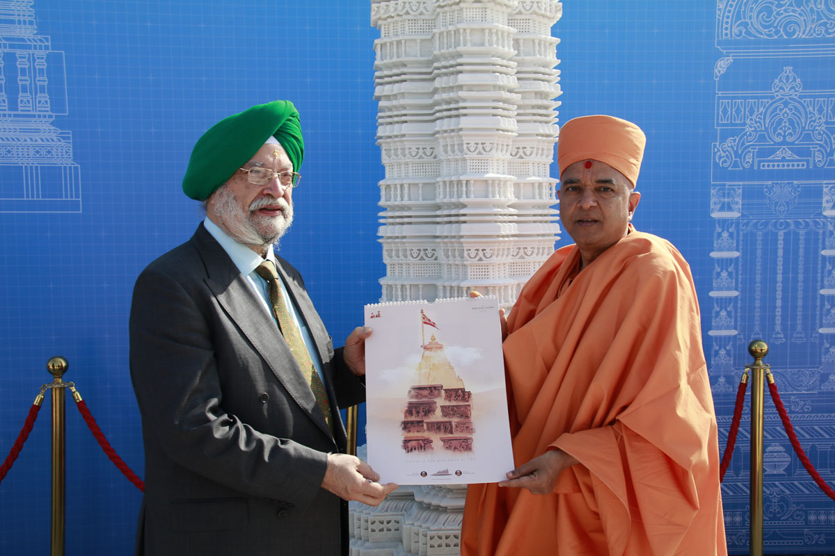 Brahmavihari Swami presents the 'Calendar of Values' to Honorable Hardeep Singh Puri
