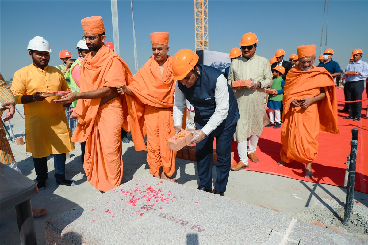 Vijaybhai Rupani places the first sanctified brick
