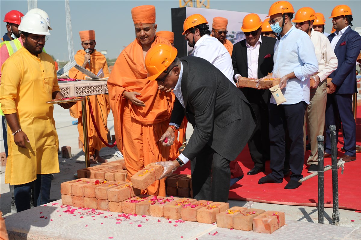 Yogeshbhai Mehta places a sanctified brick