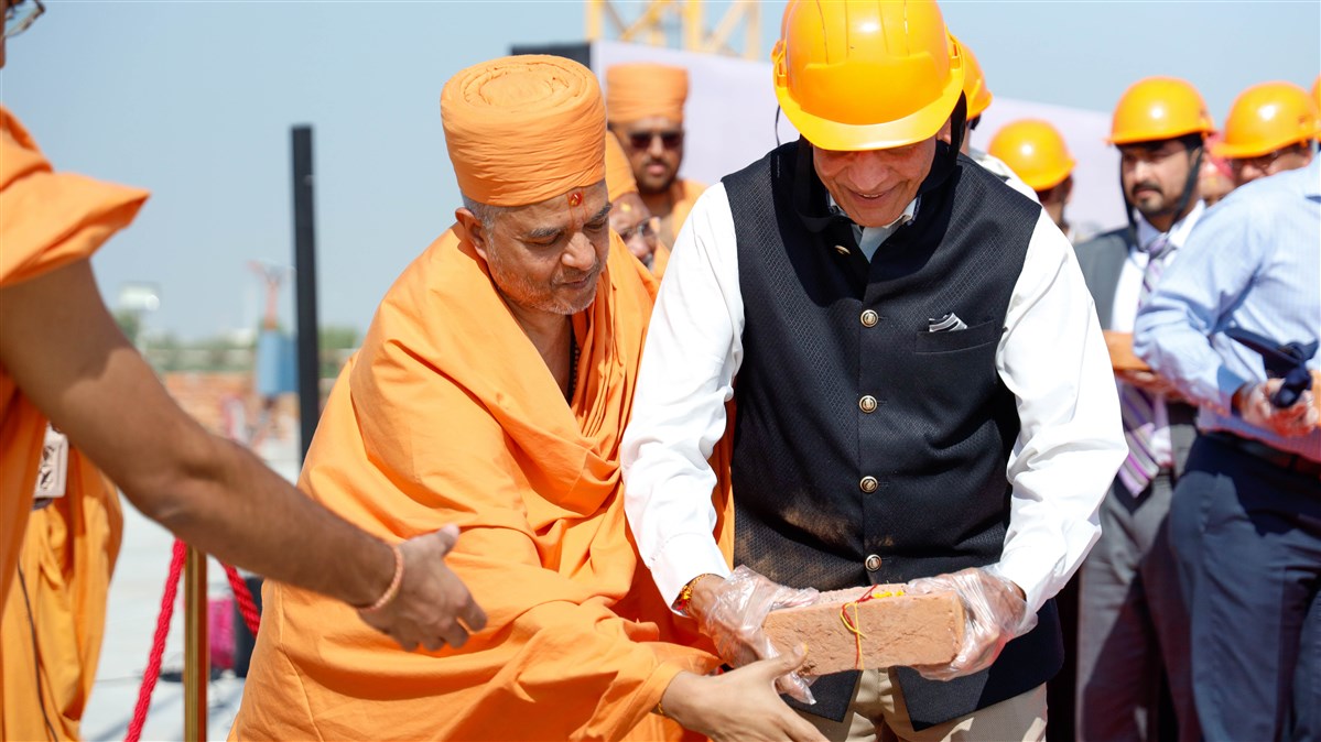 Mahendrabhai Patel places a sanctified brick