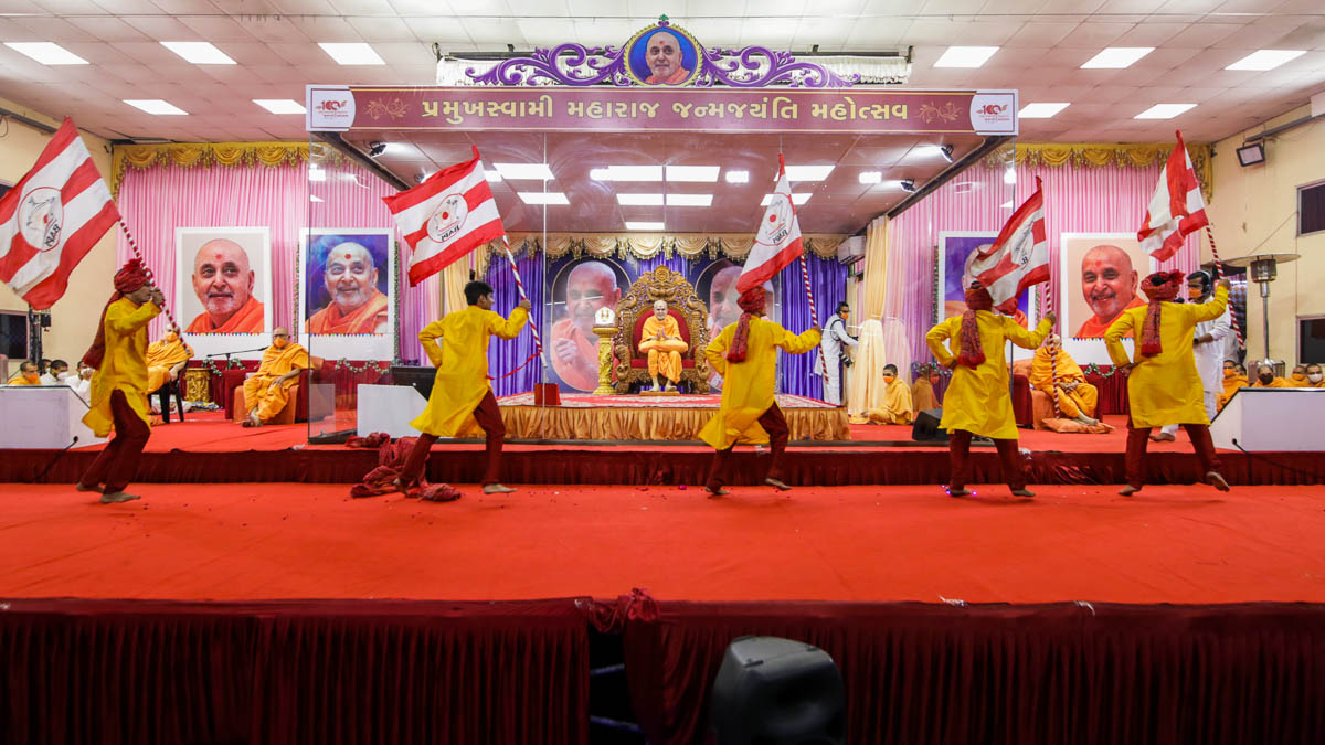 Youths perform a traditional dance in the evening assembly