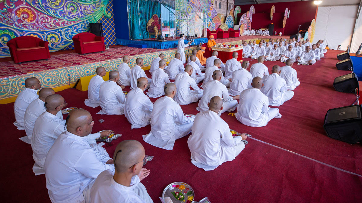 Sadhaks perform the diksha mahapuja rituals in the evening assembly