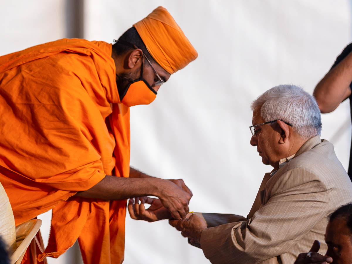 Fathers of sadhaks engaged in mahapuja rituals