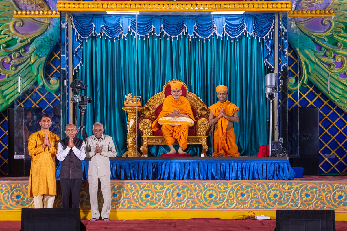 Swamishri with a newly initiated sadhu and his family members