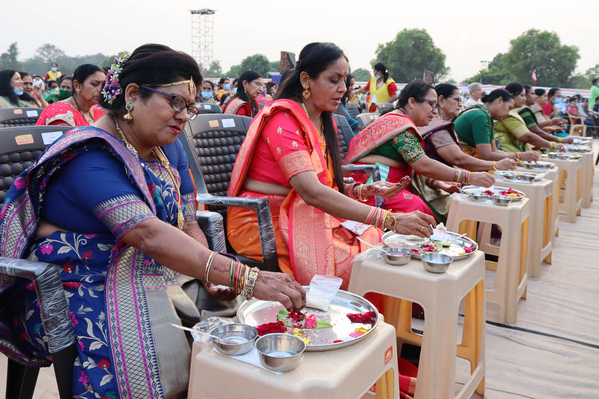 Mothers of sadhaks engaged in mahapuja rituals 