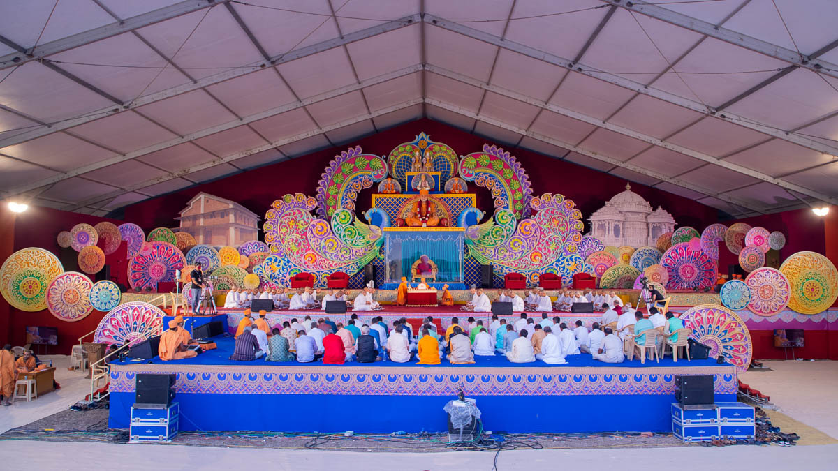 Sadhaks and their fathers perform the diksha mahapuja rituals in the evening assembly