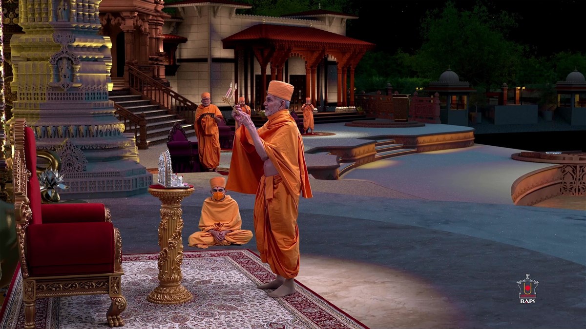 Swamishri and senior sadhus perform the arti