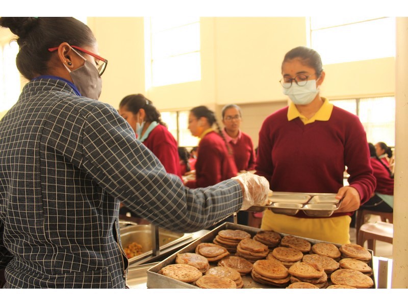 students enjoying with delicious food 