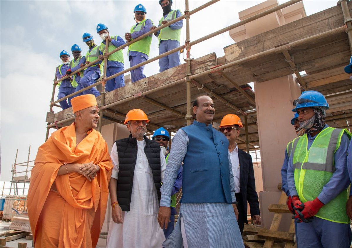 Shri Om Birlaji interacts with the craftsmen building the mandir