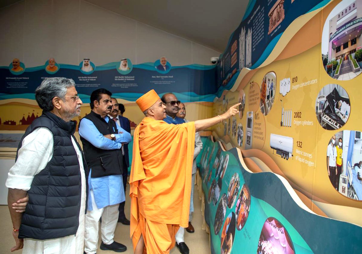 The delegation peruses the Rivers of Harmony exhibition