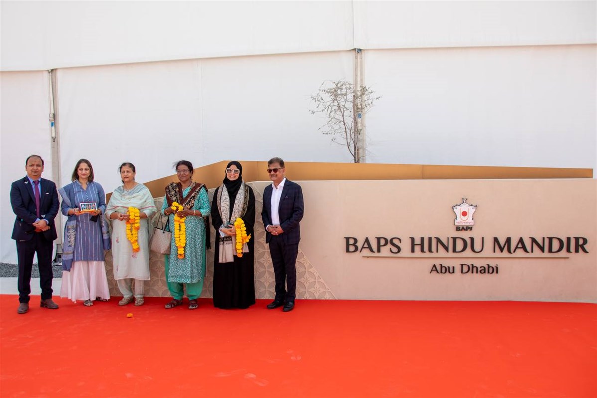Ashok Kotecha (right), senior BAPS volunteer, welcomes Smt Fauzia Tahseen Ahmed Khan and members of the senior delegation to the mandir