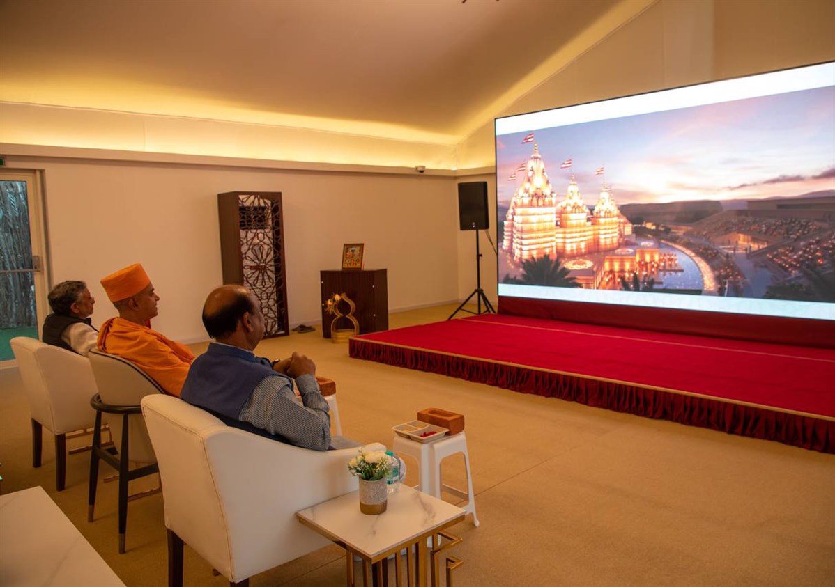 The delegation views the History of Harmony video